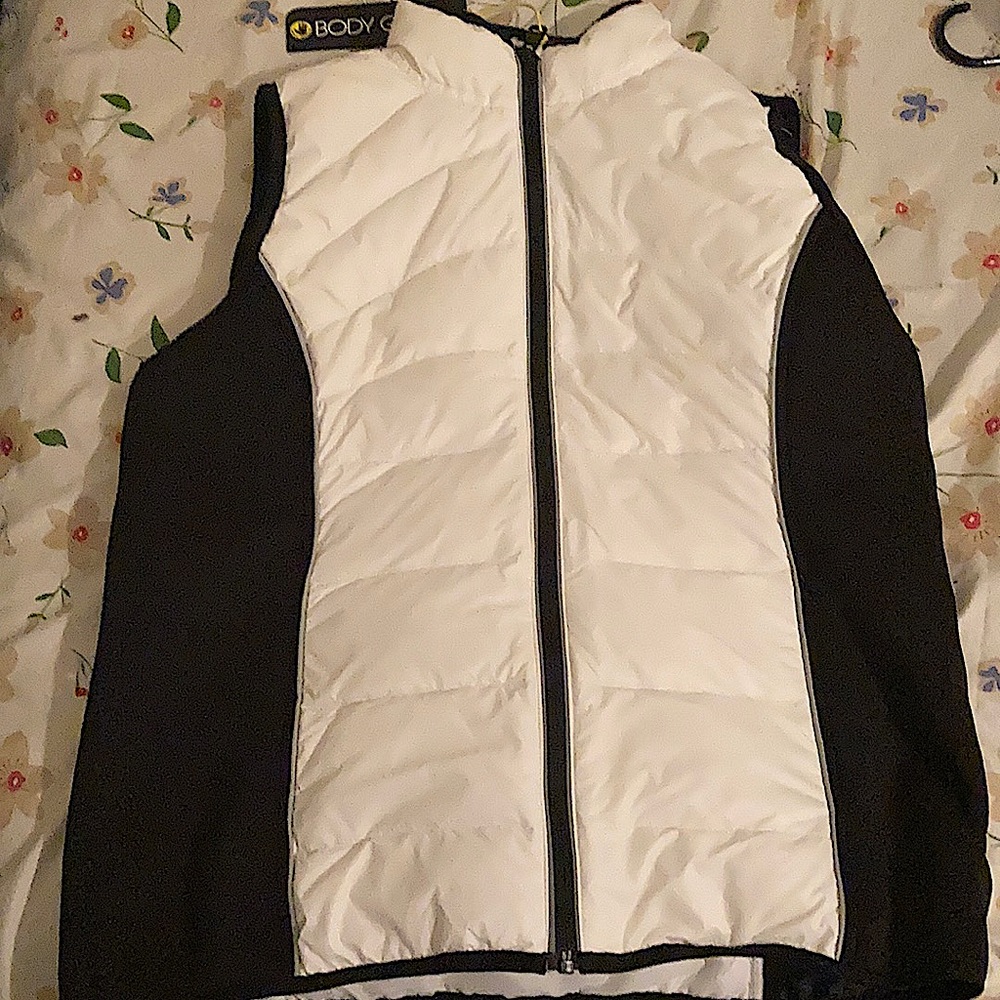 Body glove, has two pockets with zipper, black material is very soft.